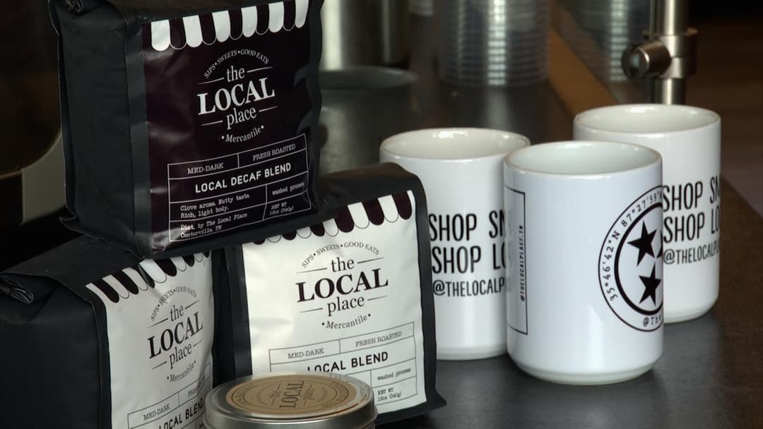 LOCAL Blend and LOCAL Decaf Blend coffee bags with branded mugs at The LOCAL Place Centerville TN