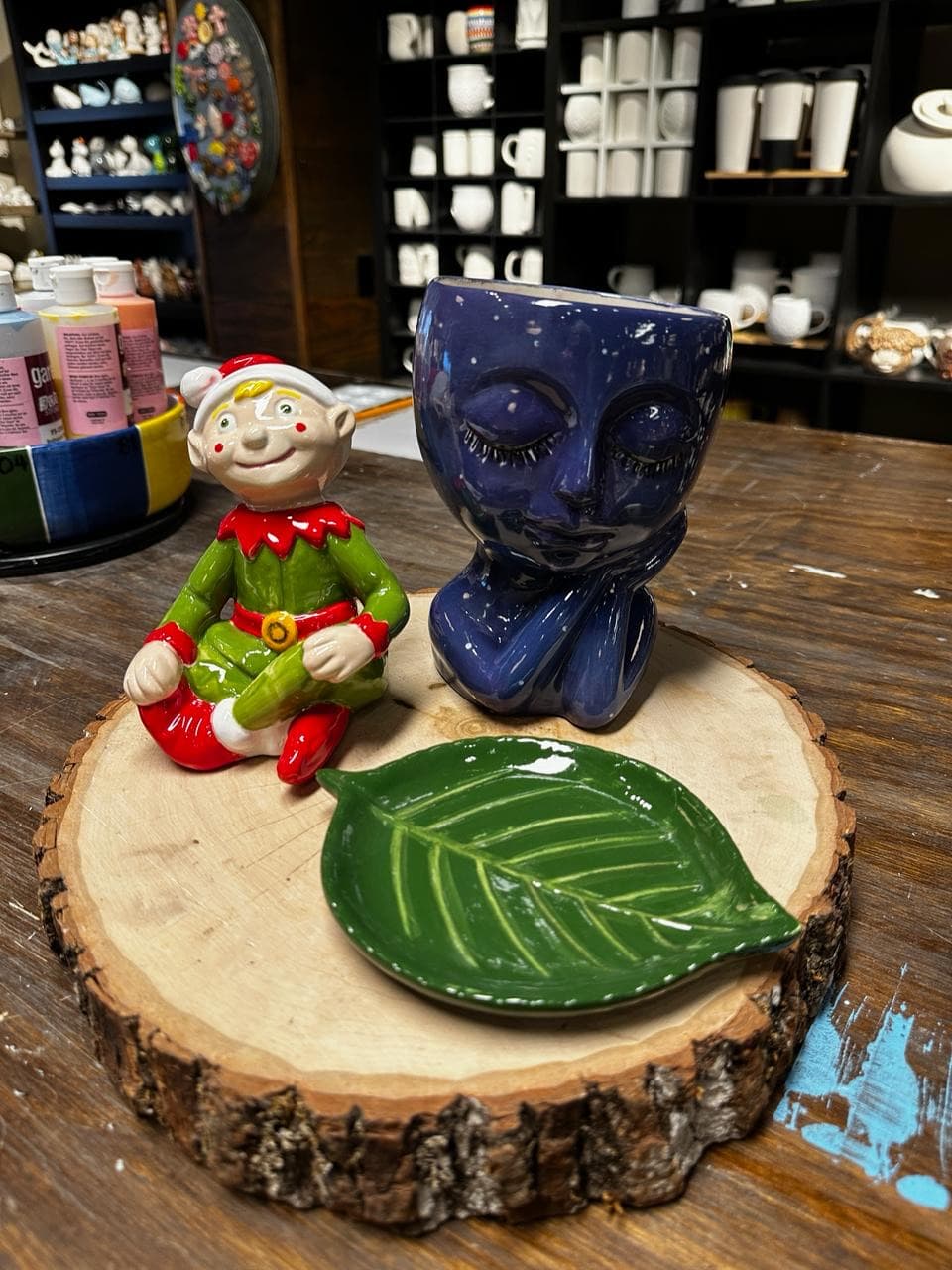 Glazed elf figurine, face planter, and leaf dish after kiln firing at MADE @ The Local pottery studio in Centerville, TN