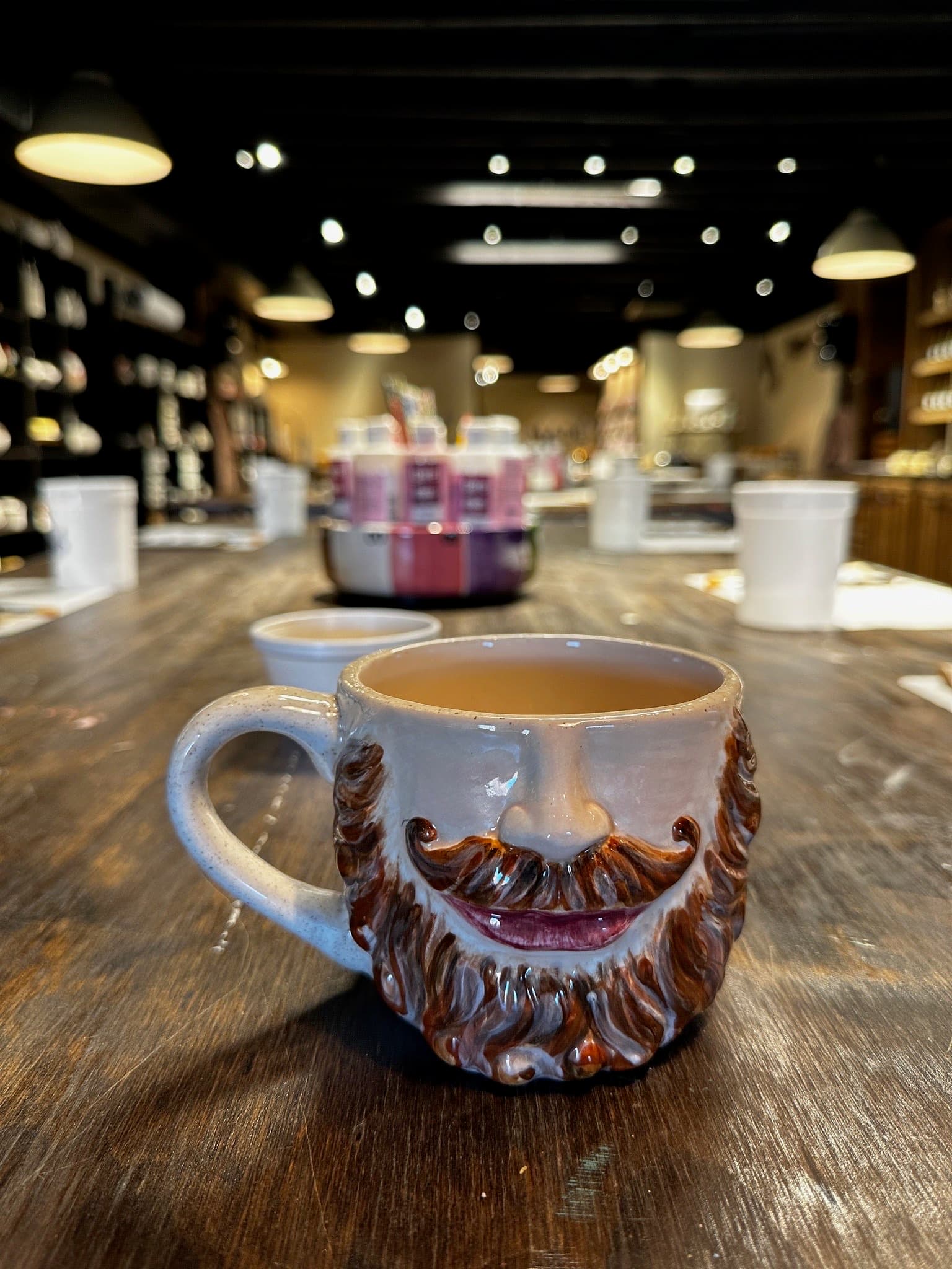 Glazed bearded face mug with sculpted brown beard and mustache at MADE @ The Local pottery studio in Centerville, TN