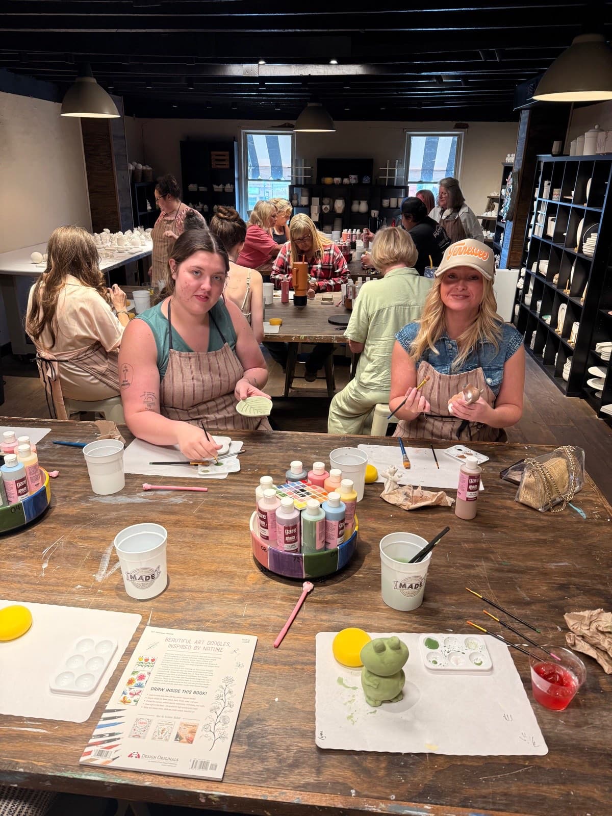 Bachelorette group painting pottery together at MADE