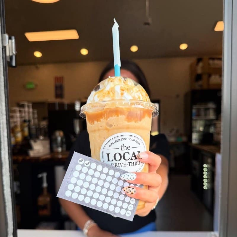 Loyalty punch card with frappe at The LOCAL Drive-Thru window — Double Punch Tuesdays